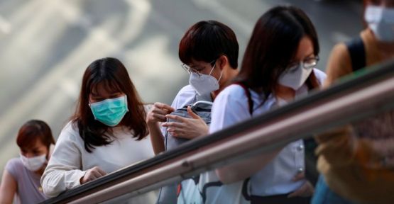 Çin, koronavirüsün yeni semptomlarını ve bulaşma yollarını açıkladı